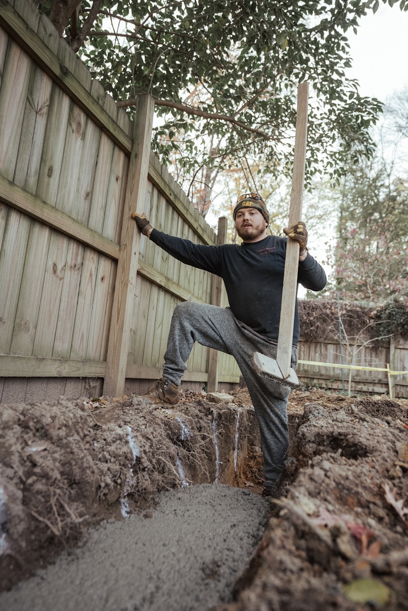 a man holding a shovel with contractors insurance